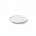 A round white ceramic plate with a textured concentric spiral pattern, shown from a top-down angle on a white background.